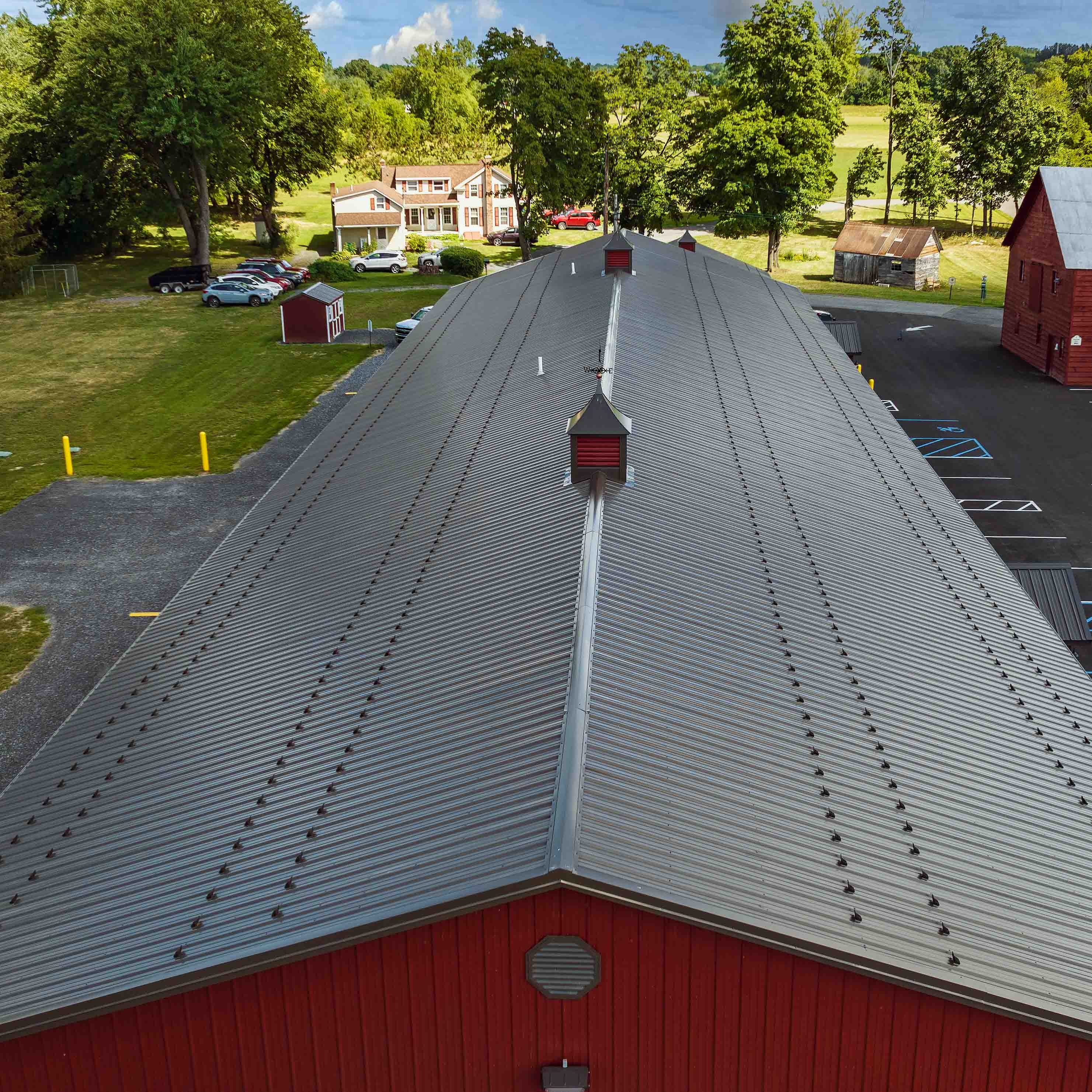Willow Creek Metal Materials - composite shot on location in Selkirk NY willow creek metal roof on building composite aerial view shot via drone
