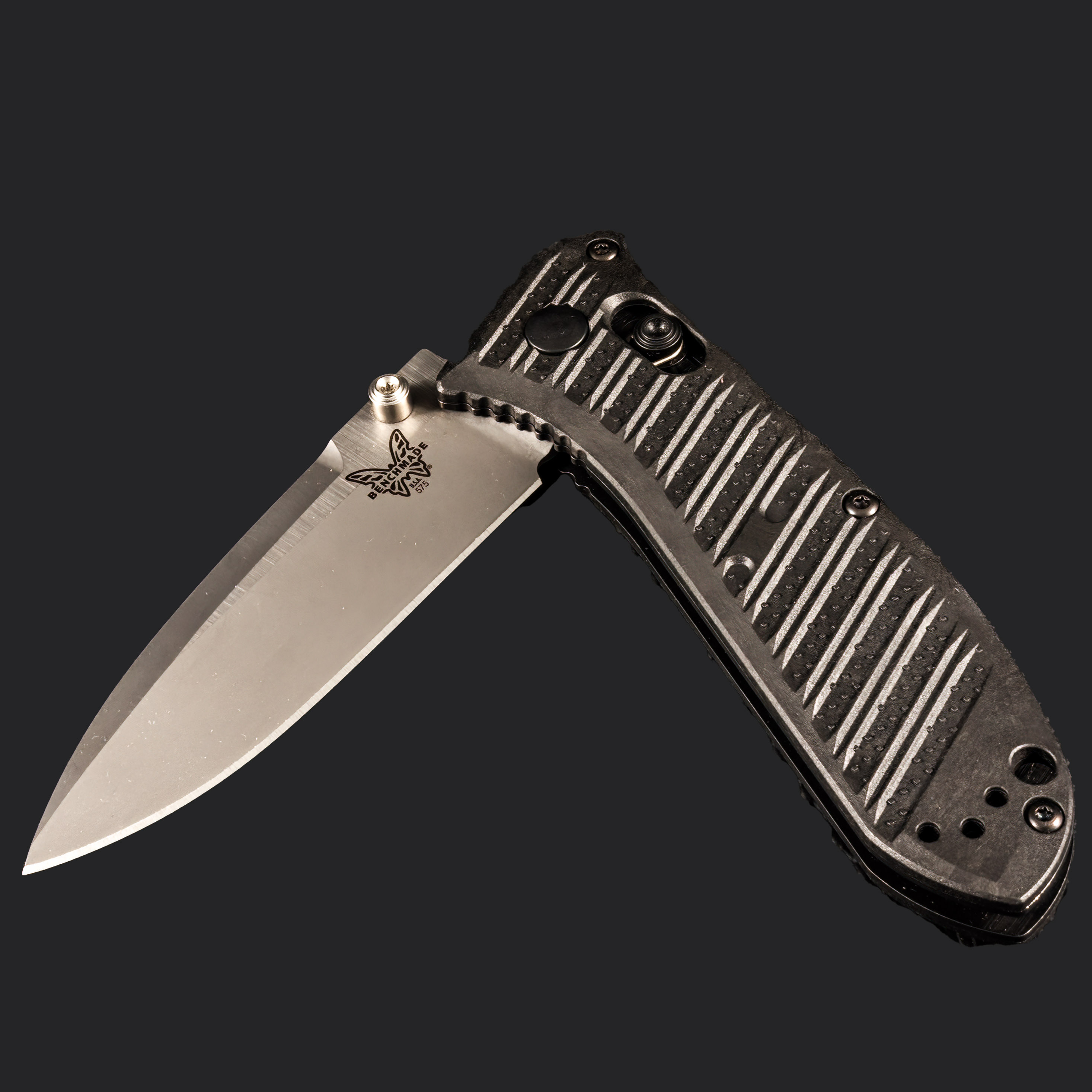 EDC knife on non-white background - shot in studio Benchmade EDC knife on black background shot in studio